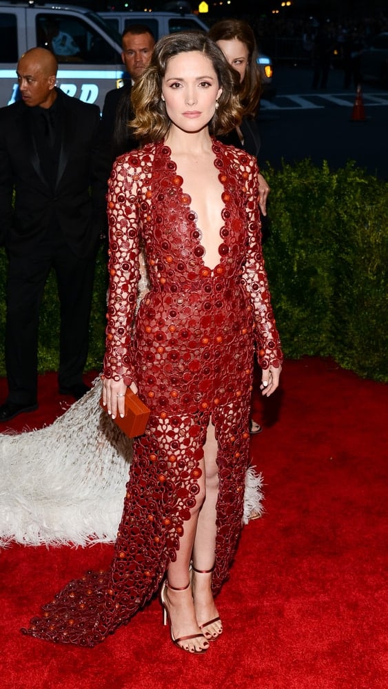 On May 04, 2015, Rose Byrne attended the 'China: Through The Looking Glass' Costume Institute Gala, held at the Metropolitan Museum of Art in New York City, New York. She wore a sexy red dress that [aired well with her tousled and wavy chin-length bob hairstyle with highlights.