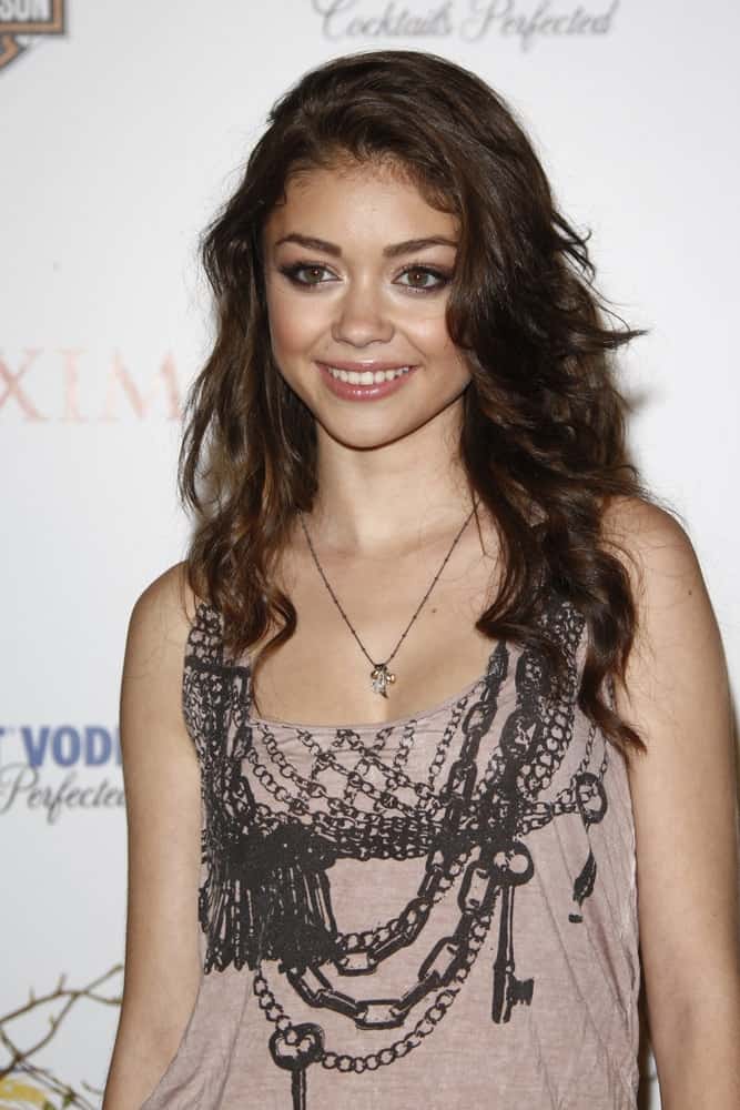 Sarah Hyland was at the 11th annual Maxim Hot 100 Party at Paramount Studios on May 19, 2010 in Los Angeles, California. She opted for a casual outfit with her long and tousled laters that has side-swept bangs.