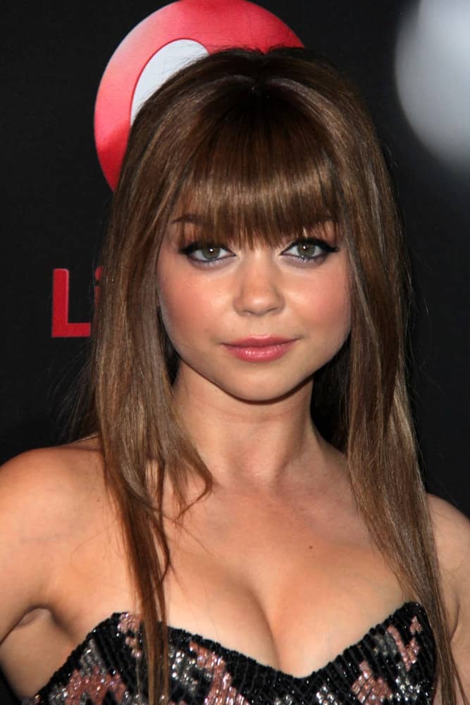 Sarah Hyland was at the "Call Me Crazy: A Five Film" Premiere at the Pacific Design Center on April 16, 2013 in West Hollywood, CA. She was charming in a strapless dress that she paired with a straight medium-length brunette hairstyle incorporated with blunt bangs.
