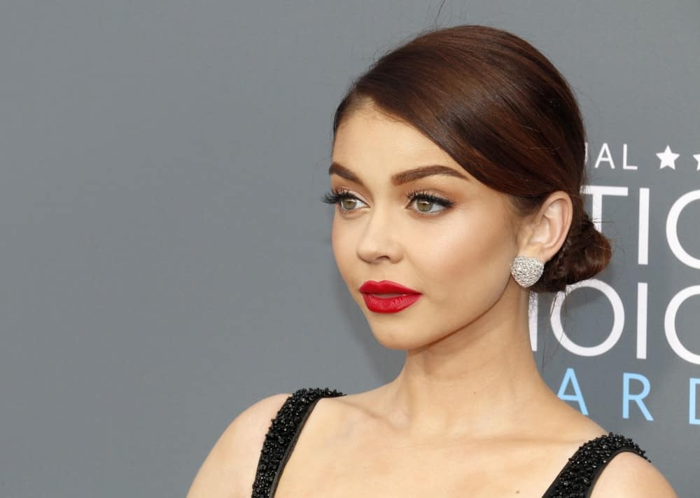 Sarah Hyland was at the 23rd Annual Critics' Choice Awards held at the Barker Hangar in Santa Monica on January 11, 2018. She was elegant in a black dress that went well with her slick low bun hairstyle and red lipstick.