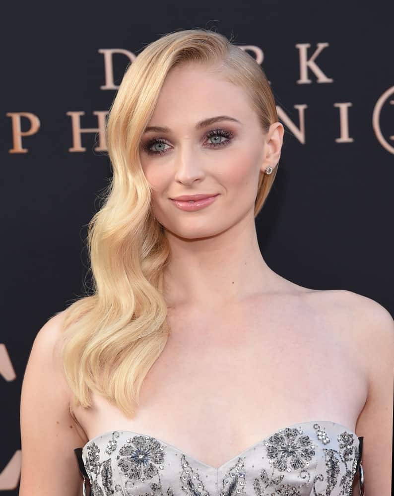 Sophie Turner flaunted her soft wavy blonde hair swept to one side during the 'Dark Phoenix' Global Premiere on June 04, 2019 in Hollywood, CA.