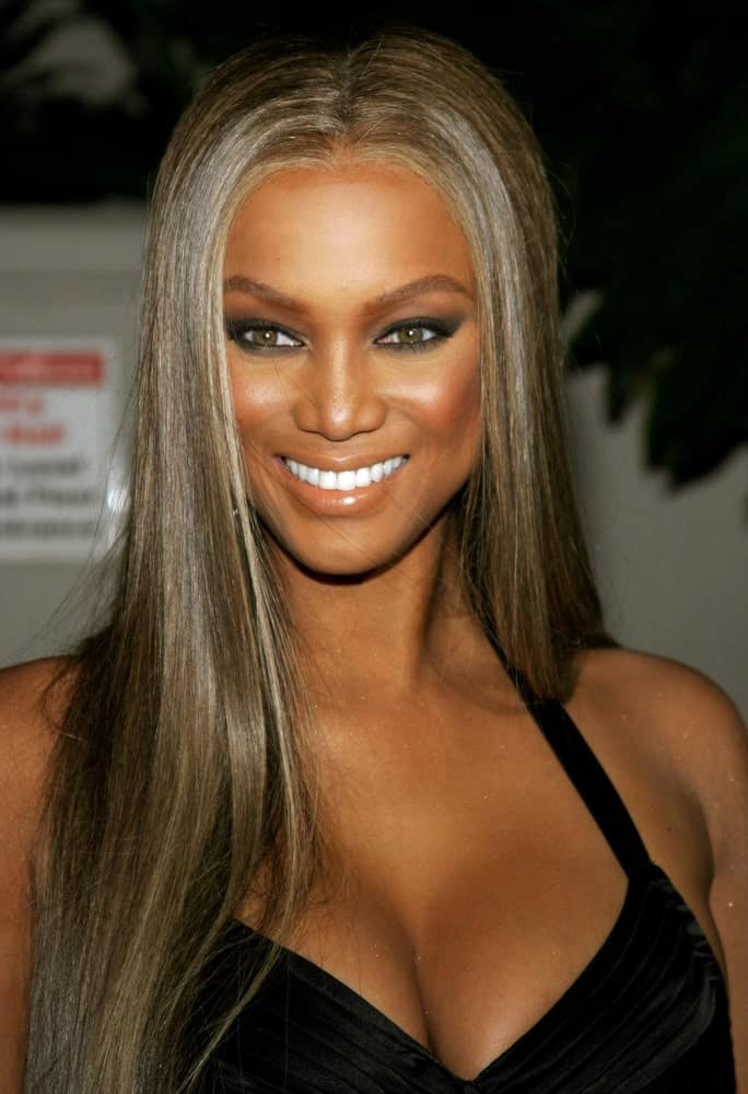 Tyra Banks' long and straight hair has a slight matallic tone to it that went well with her black dress at the Rodeo Drive Walk Of Style Award honoring Gianni and Donatella Versace held at the Beverly Hills City Hall in Beverly Hills, California on February 8, 2007.