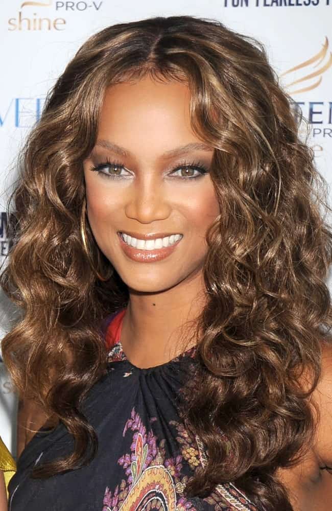 Tyra Banks' medium-lenth curly hair was perfectly tousled and toned to pair with her colorful outfit at the Cosmopolitan's Fun Fearless Phenom Awards, Hearst Tower in New York on September 15, 2008.