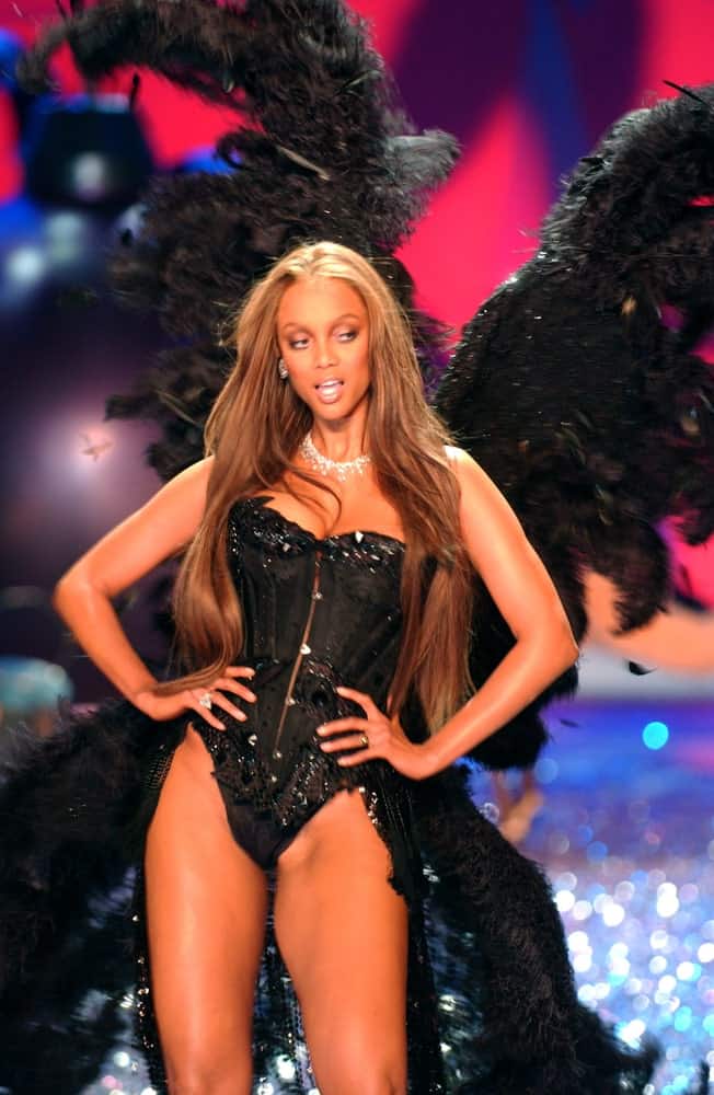 Tyra Banks walked the runway of the 2010 Victoria's Secret Fashion Show at the Lexington Armory in New York City. She was confident in her black costume and long, layered hair that is loose and tousled.