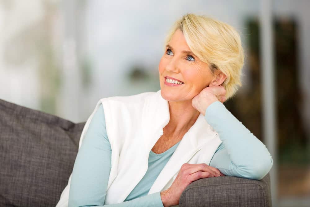 Woman over 50 with short blonde hair.