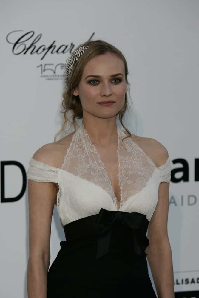 The German-American actress looks adorable in a messy up-do with a diamond leaf accessory in it at the AMFAR Cinema Against Aids Gala on May 20, 2010.