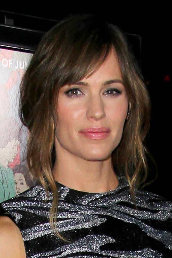 The mother-of-three was looking lovely as she wears her honey-coloured tresses in a messy bun with side-swept bangs at the "Men, Women And Children" - Los Angeles Premiere on September 30, 2014.