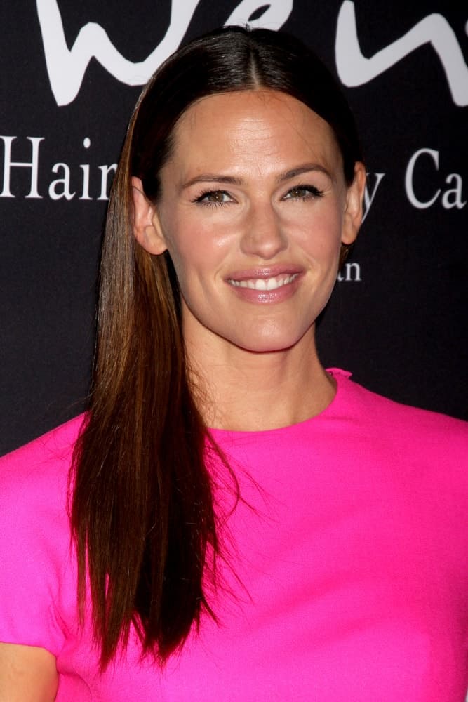 She paired her fuchsia frock with a simple straight 'do, swept to the side at the Pink Party 2014 on October 18, 2014.