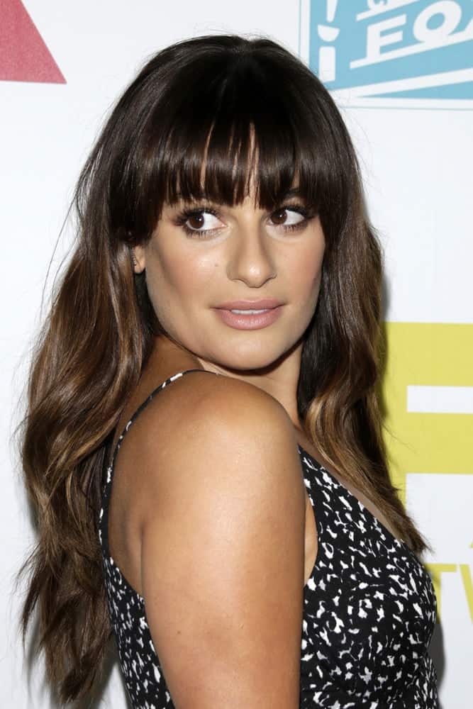 Lea Michele looks so adorable in this wavy loose hairstyle with blunt bangs at the 20th Century Fox Party Comic-Con Party on July 10, 2015.
