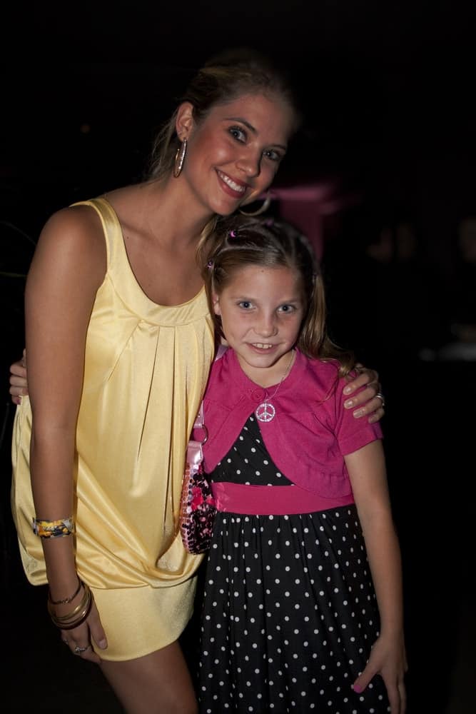 Ashley Benson attended the 3rd annual Evening with the Stars prior to the 62nd annual Mother Goose Parade on November 22, 2008 in San Diego, CA. She posed with a fan wearing a yellow dress to pair with her neat sandy blonde ponytail.