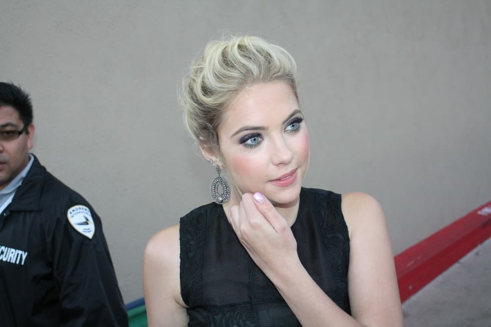 Ashley Benson was greeting fans outside the Jimmy Kimmel Studios on July 20, 2011 in Hollywood, CA. She wore a simple black dress to go with her messy and tousled highlighted blond hairstyle.