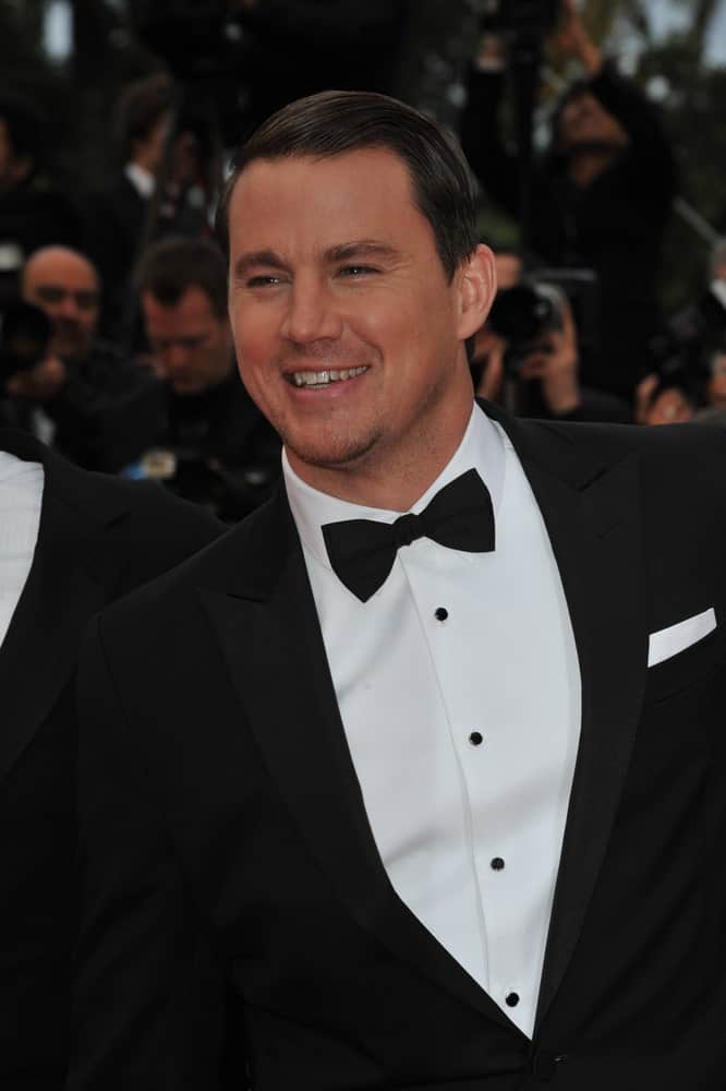 The actor exhibited his short dark locks emphasized with a black bow during the gala premiere of his movie "Foxcatcher" at the 67th Festival de Cannes on May 19, 2014.