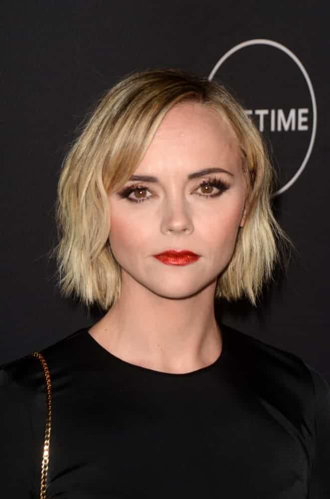 Christina Ricci was at the Lifetime Winter Movies Mixer at The Andaz on January 9, 2019, in West Hollywood, CA. She paired her black outfit with a tousled and highlighted chin-length blonde hairstyle.