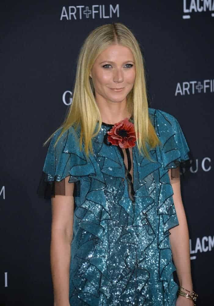 The actress in a charming ruffle dress paired with her blonde locks pin-straight with a middle part at the 2015 LACMA Art+Film Gala on November 7, 2015.