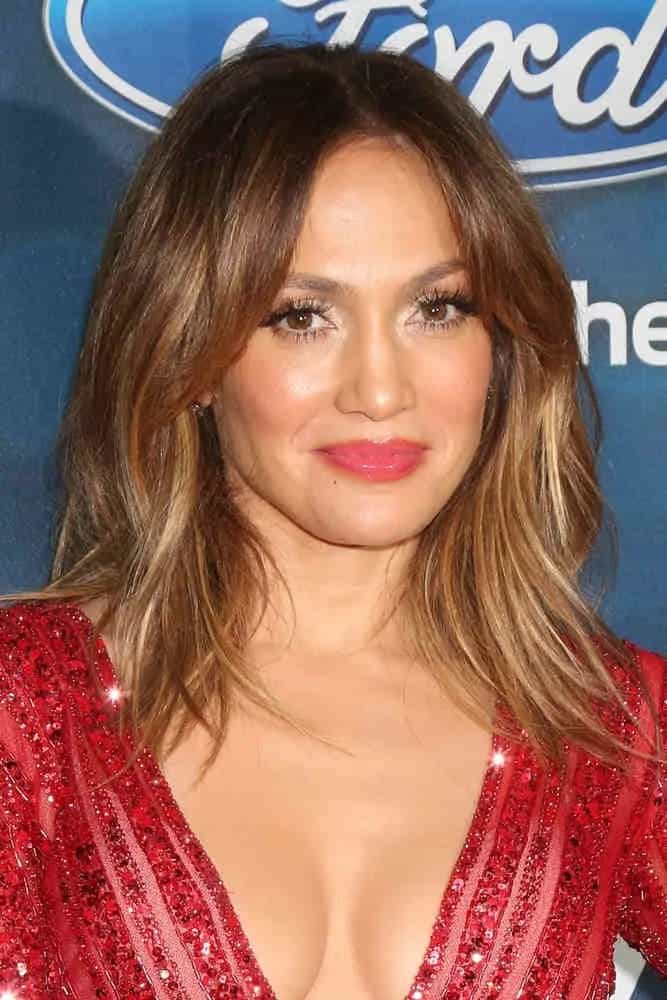 Jennifer Lopez blooms in a bob hairstyle with center-part bangs at the American Idol Farewell Season Finalist Party on February 25, 2016.