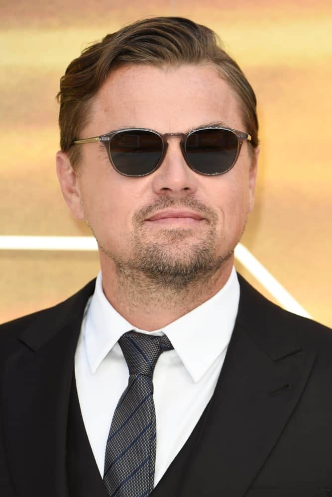 Leonardo DiCaprio paired his wavy side-swept with a goatee at the UK premiere for "Once Upon A Time In Hollywood" last July 30, 2019. Black shades and suit completed the sleek look.