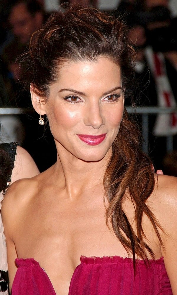 Sandra Bullock's sexy dress was a perfect fit for her messy and tousled ponytail hairstyle with highlights at The Poiret King of Fashion Metropolitan Museum of Art Costume Institute Annual Gala back in May 07, 2007.