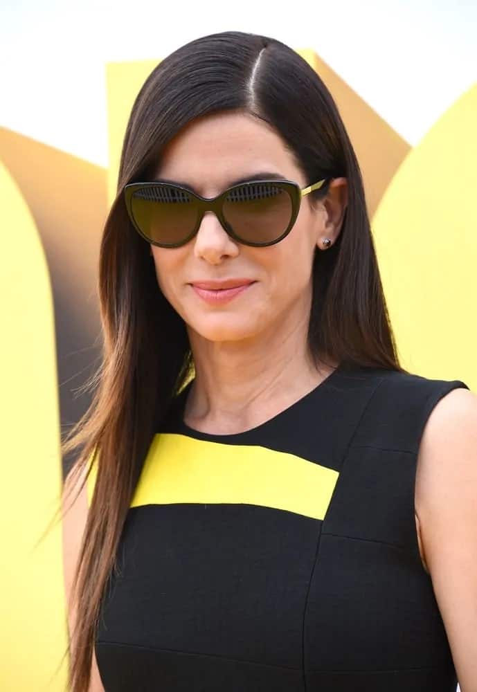 Sandra Bullock was quite lovely wearing her layered hair slick and straight with a side part when she attended the "Minions" Los Angeles Premiere back in June 27, 2015.