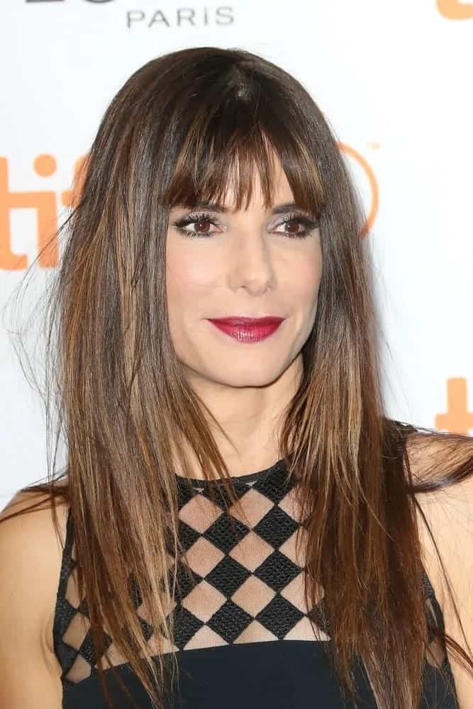 Sandra Bullock looked absolutely stunning with her loose straight hair that has blunt bangs at the 2015 'Demolition' premiere and opening night gala back in September 10, 2015.
