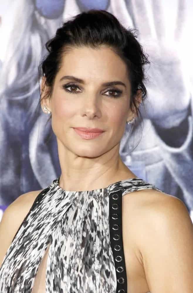 Sandra Bullock swept her raven hair up into a messy but classy upstyle with tendrils at the Los Angeles premiere of 'Our Brand Is Crisis' on October 26, 2015.