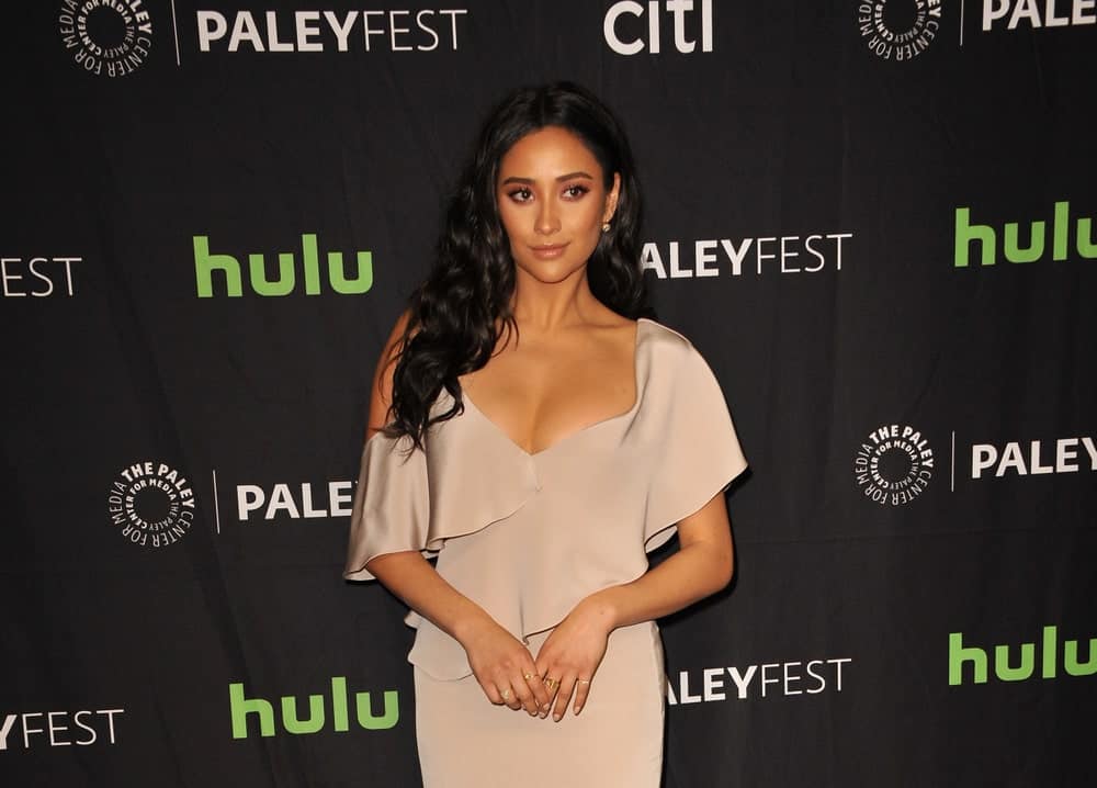 With her raven mane styled into loose curls and tucked behind one ear at the 34th Annual PaleyFest Los Angeles - "Pretty Little Liars" on March 25, 2017.