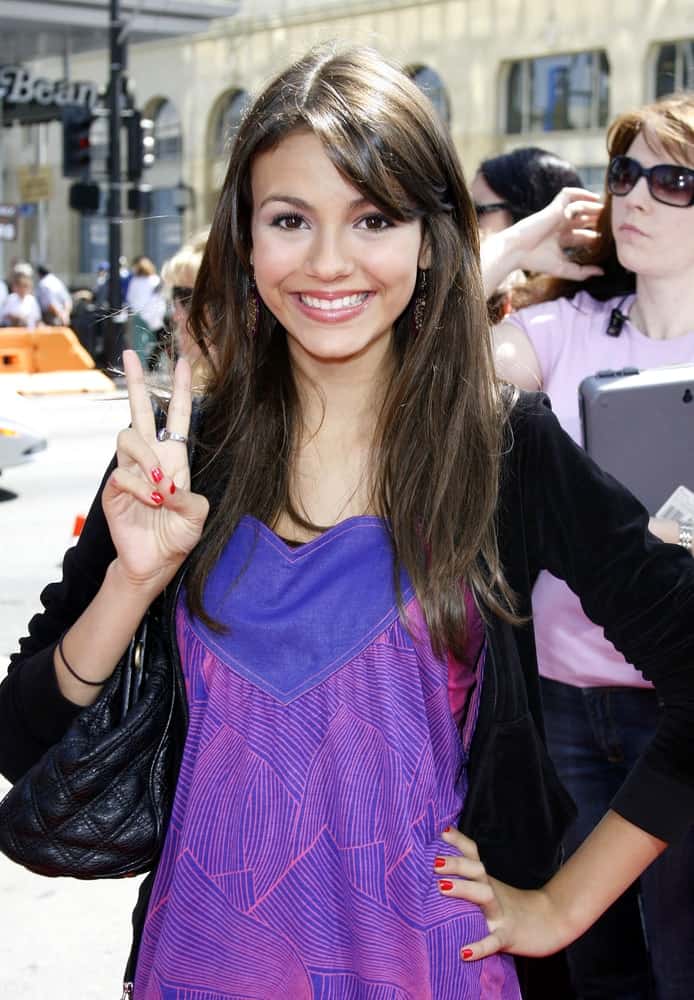 Victoria Justice was at the World premiere of 'Nancy Drew' held at the Grauman's Chinese Theater in Hollywood on June 9, 2007. She wore a jacket on her purple casual dress and paired it with a long and loose layered hairstyle with side-swept bangs and highlights.
