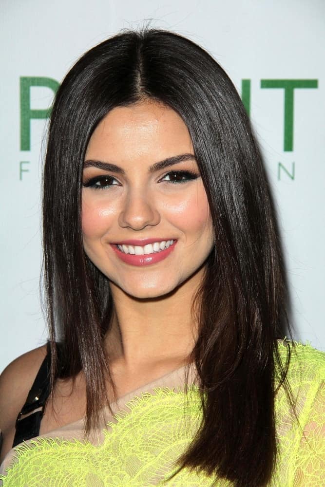 Victoria Justice was at the "Voices On Point" Gala at Century Plaza Hotel on September 7, 2013 in Century City, CA. She paired her stunning yellow dress with a long and slick straight hairstyle with layers.
