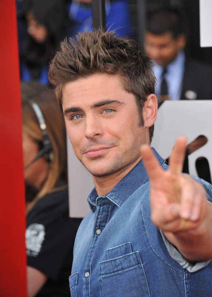 Zac Efron sported a boyband hairdo with short spiky hair during the 2014 MTV Movie Awards at the Nokia Theatre LA Live on April 13, 2014.