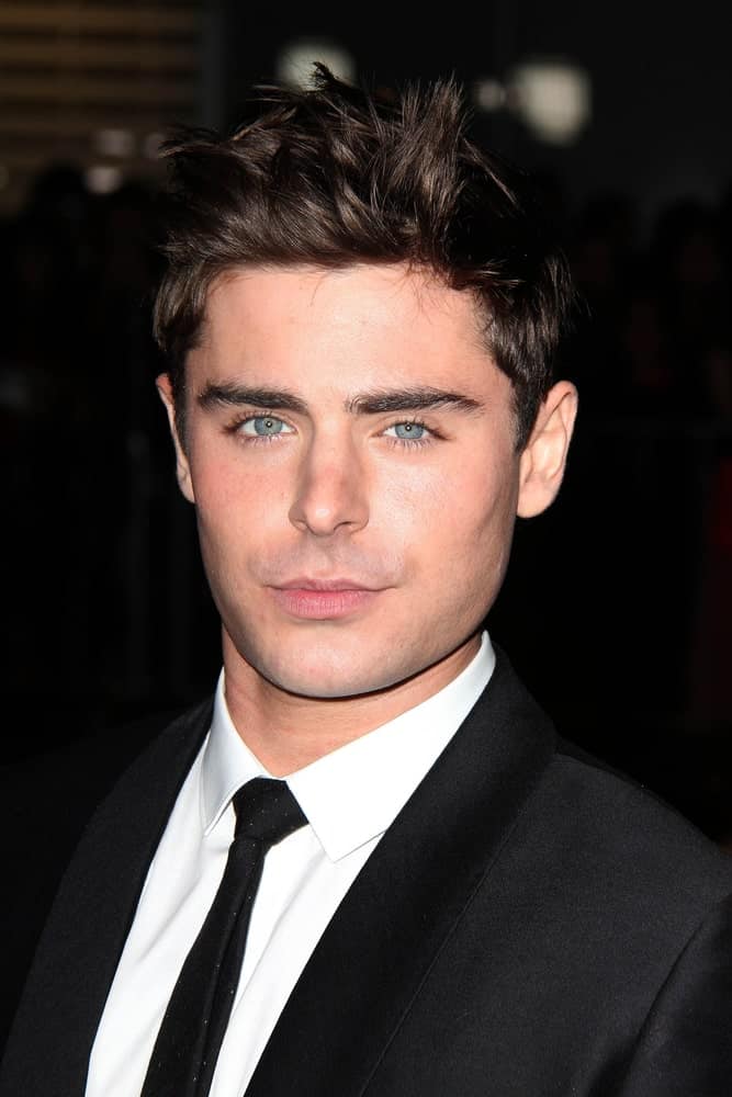Zac Efron paired his classic black suit with brushed up spikes during the "That Awkward Moment" LA Premiere at Regal 14 Theaters on January 27, 2014.