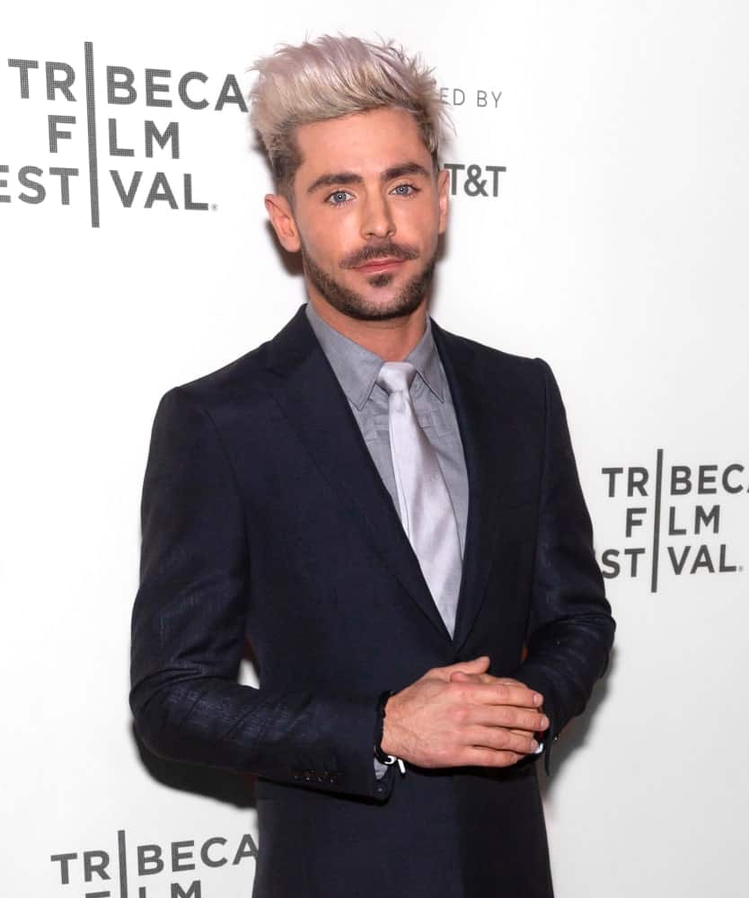 Zac Efron rocked a pompadour hairstyle with short sides nicely transitioned to his medium-length goatee at the premiere of Extremely Wicked, Shockingly Evil and Vile movie held on May 2, 2019.