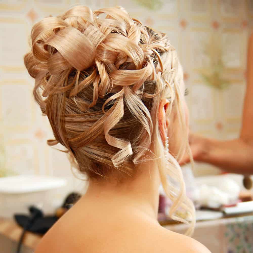 Curly updo wedding hairstyle.