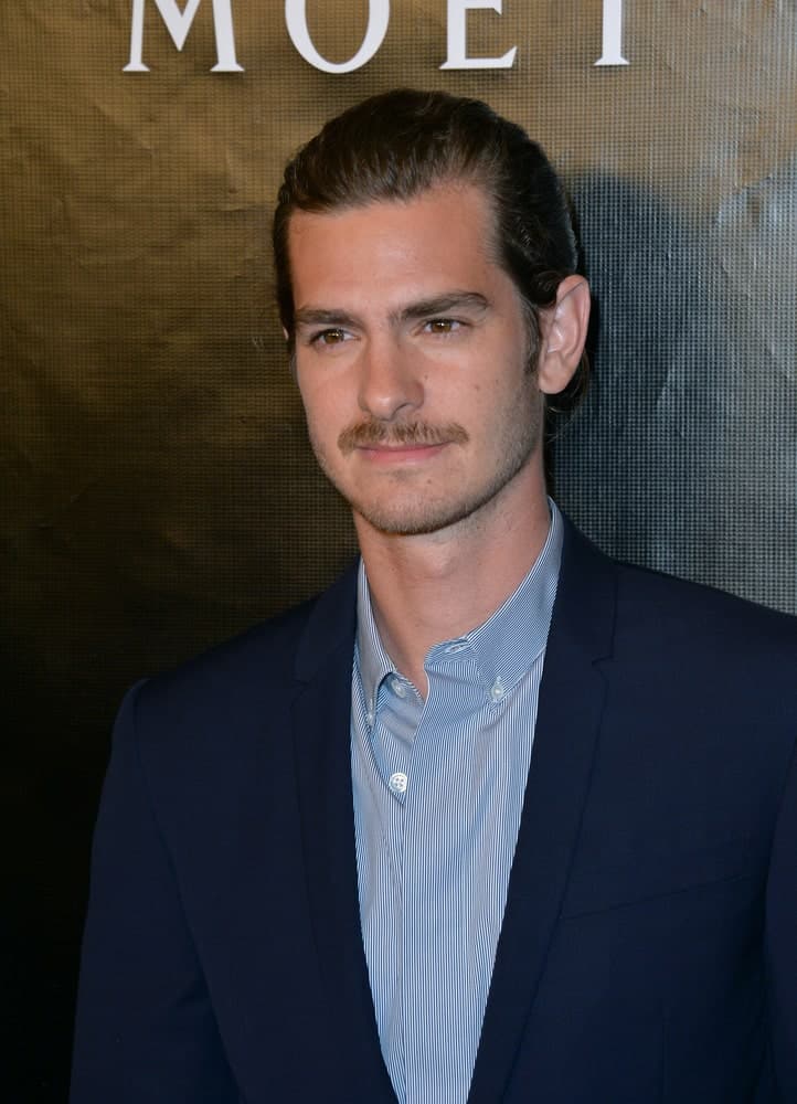 The actor showed off his manly charm in a man bun that's paired with a mustache during the Hollywood Foreign Press Association's Grants Banquet at the Beverly Wilshire Hotel on August 13, 2015.