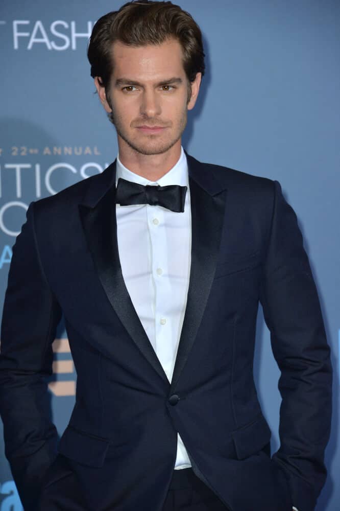 Andrew Garfield at the 22nd Annual Critics' Choice Awards at Barker Hangar, Santa Monica Airport on December 11, 2016 with his signature hairstyle on.