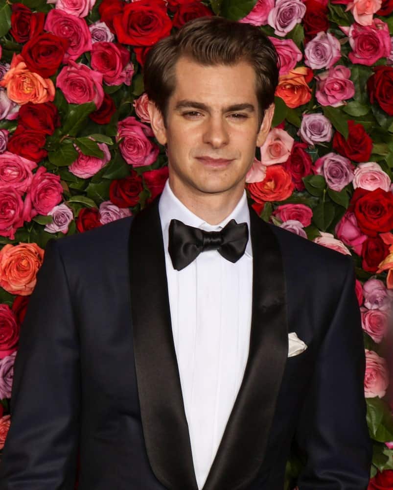 Andrew Garfield is oozing with charm in this classic black suit along with his brunette hair that's neatly brushed during the 72nd Annual Tony Awards at Radio City Music Hall on June 10, 2018.