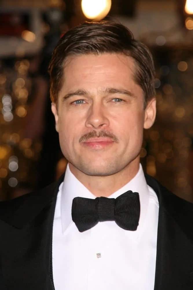 Brad Pitt paired his classic tuxedo with a thin mustache and a side-parted slick short hairstyle at the 2008 Premiere of 'The Curious Case of Benjamin Button' in Los Angeles.
