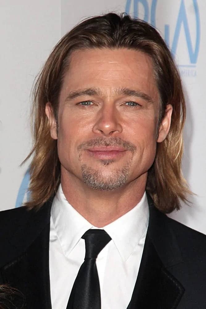 Brad Pitt wore a feathered look on his long center-parted hairstyle with highlights at the 23rd Annual Producers Guild Awards, Beverly Hilton, Beverly Hills back in 2012.