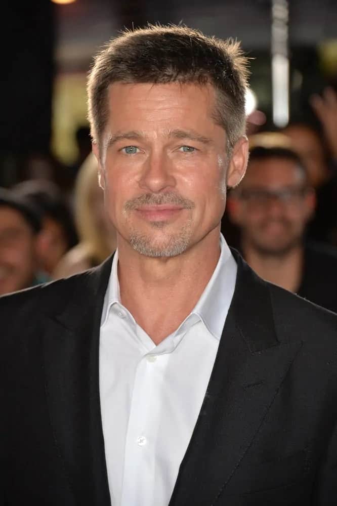 Brad Pitt wore a clean tousled fade hairstyle and a trimmed goatee at the special fan screening for "Allied" back in 2016. He paired this with a white button shirt under his black suit.
