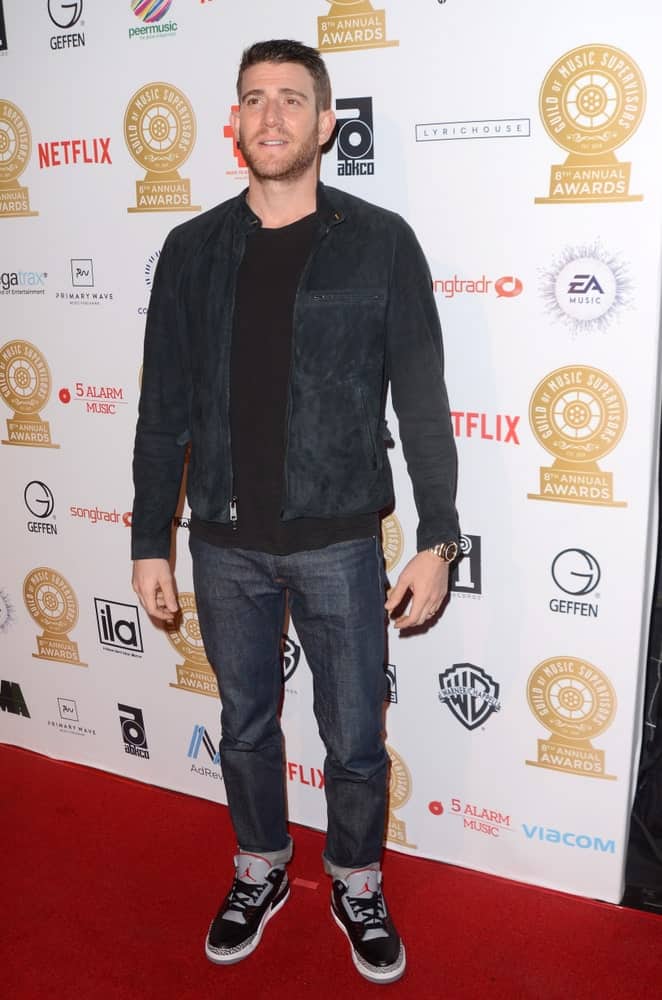Bryan Greenberg sported a short fade haircut with a trimmed beard at the Guild of Music Supervisors Awards at The Theatre last February 8, 2018 in Los Angeles, CA. He wore a casual outfit with his Jordan sneakers.