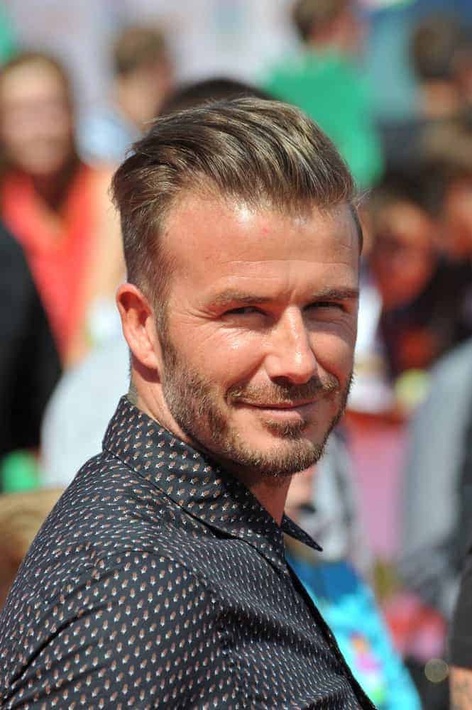 David Beckham paired his taper cut hairstyle with a bearded look during first annual Nickelodeon Kids Choice Sports Awards at Pauley Pavilion, UCLA in 2014.