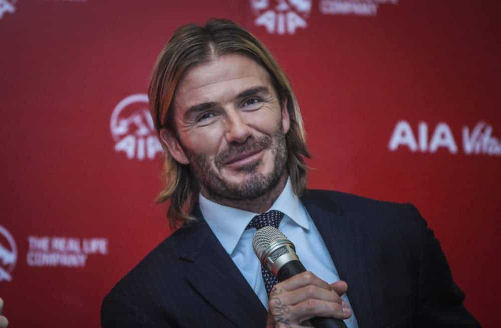 David Beckham pulls off the long hair look with middle parting at the AIA Vitality Healthy Living Tour on September 22, 2017, Kuala Lumpur Malaysia.