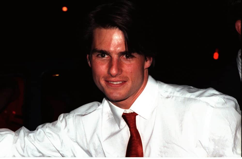 Tom Cruise looked young and fresh in this October 11, 1993 photo when he was leaving Spago Restaurant in Los Angeles. He was wearing a white button-down shirt with his long center-parted hairstyle.