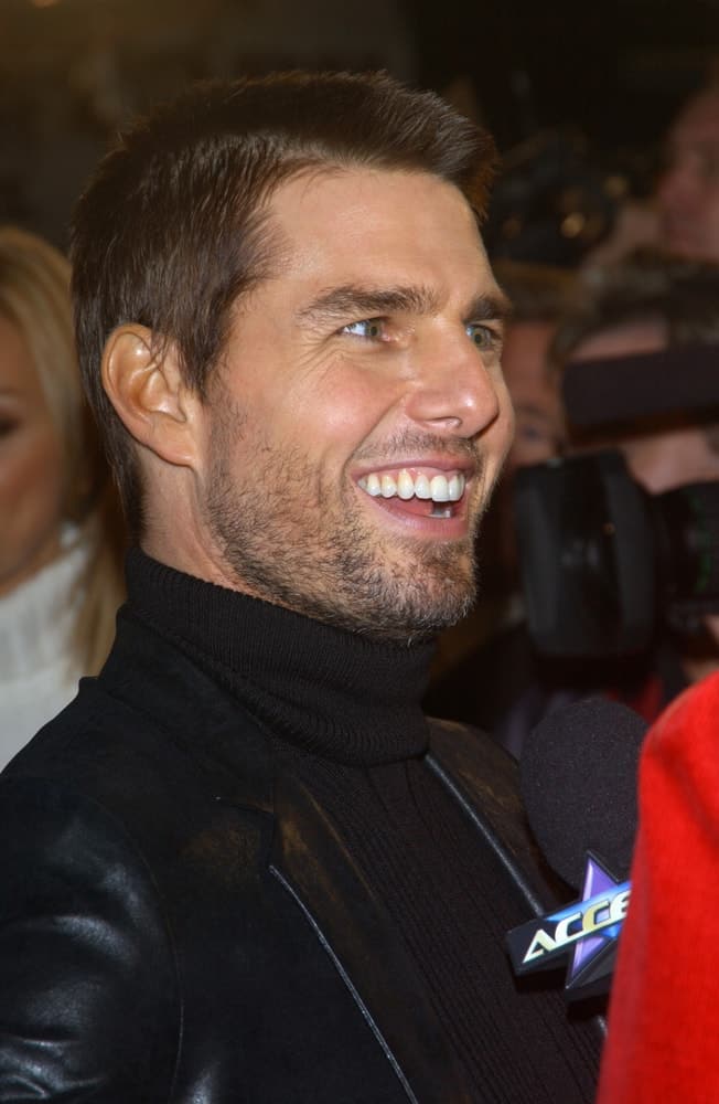 Tom Cruise was at the Los Angeles premiere of his new movie The Last Samurai back in December 1, 2003. He wore a black turtle neck and leather jacket with his crew cut hairstyle and trimmed beard.