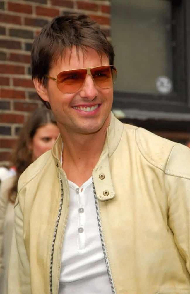Tom Cruise wore a casual light tan jacket with his fringe bangs  and a pair of vintage sunglasses at "The Late Show with David Letterman" at The Ed Sullivan Theater in New York last May 02, 2006.