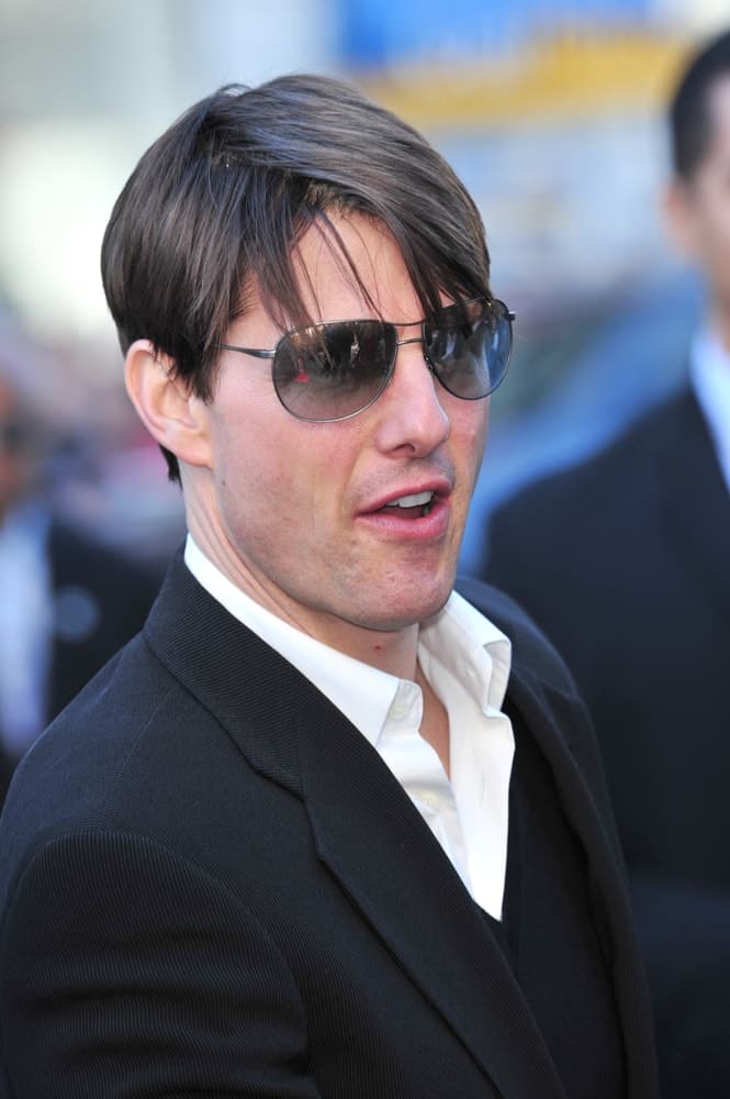 Tom Cruise was at the Grauman's Chinese Theatre, Hollywood, where Will Smith was honored by having his hand & footprints set in cement last December 10, 2007. He wore a pair of sexy sunglasses with his straight tousled hairstyle.