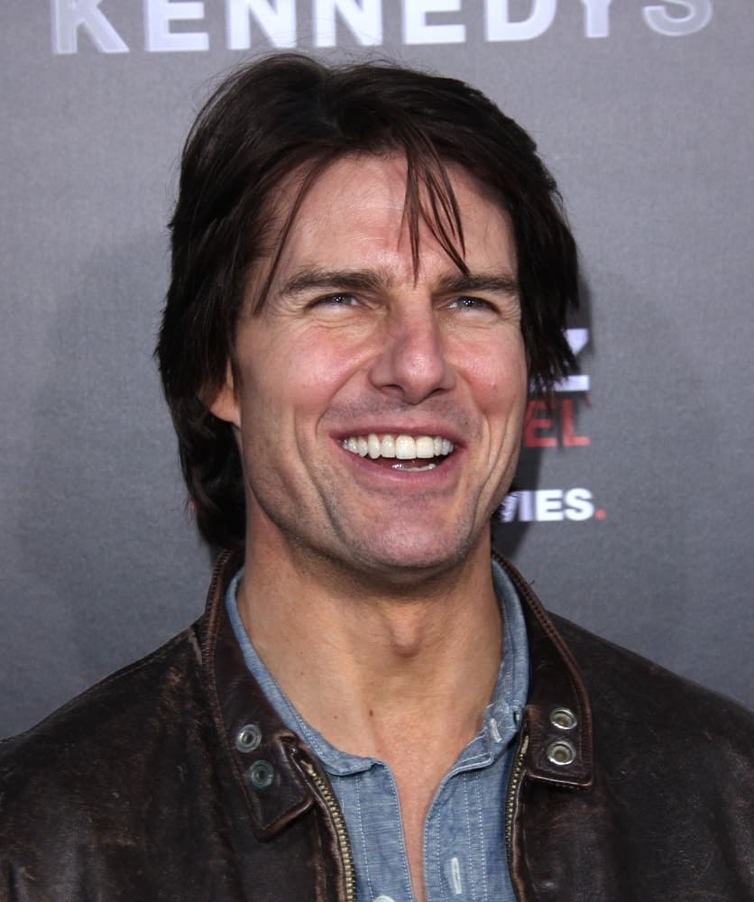 Tom Cruise went with a more casual long and tousled hairstyle incorporated with bangs when he attended the "The Kennedys" World Premiere last April 11, 2011 in Hollywood, CA.