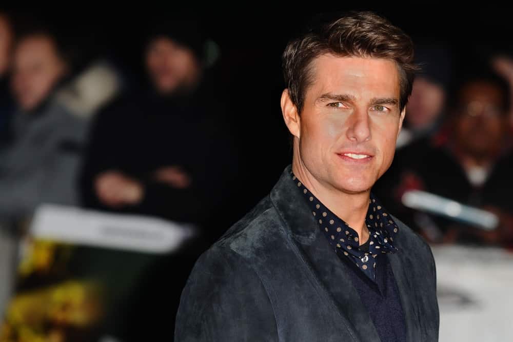 Tom Cruise sported a gorgeous side-parted pompadour hairstyle with his velvet suit for the "Jack Reacher" premiere at the Odeon Leicester Square in London back in October 12, 2012.