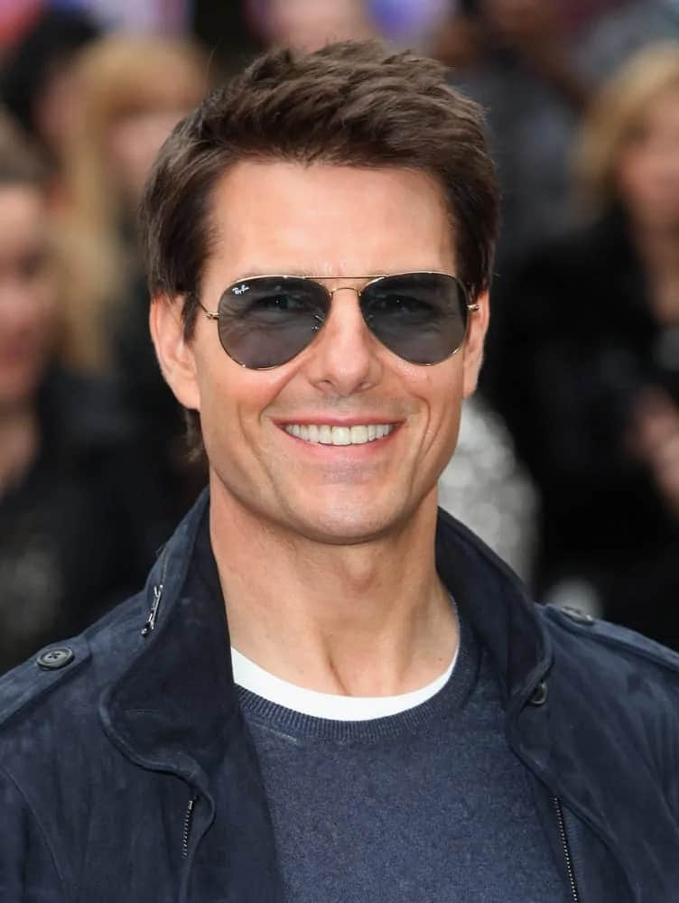 Tom Cruise went with a spiky highlighted hairstyle that complemented his casual outfit at the "Rock Of Ages" premiere at Odeon Leicester Square, London back in 2012.