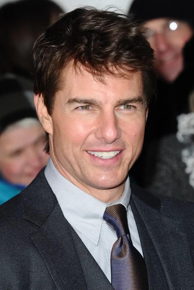 Tom Cruise made an appearance with his dark gray suit and short tousled hairstyle for The Oblivion UK Premiere at the BFI Imax, London in 2013.