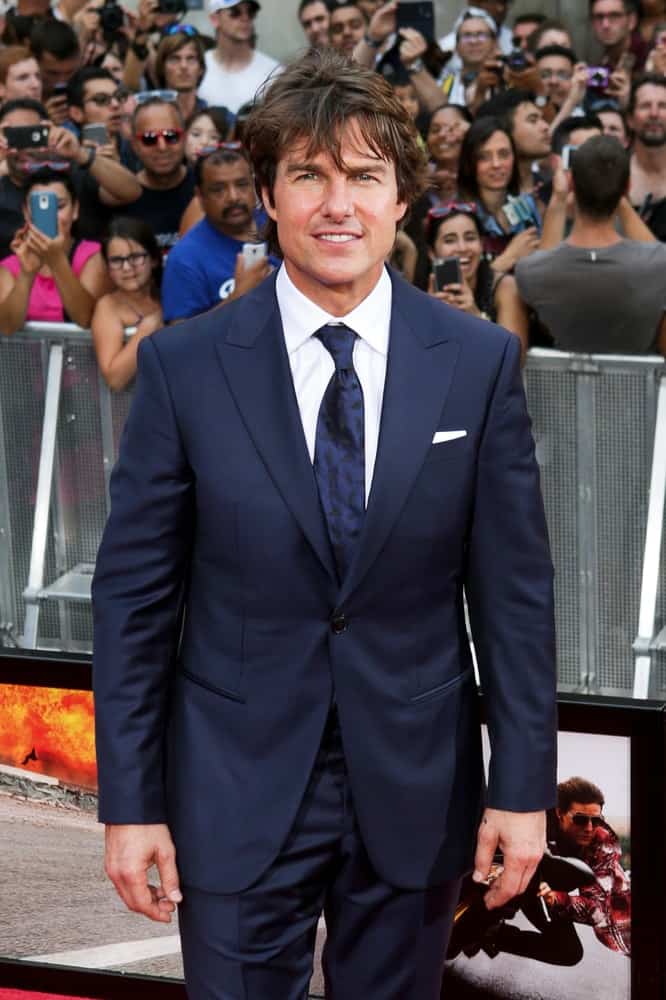 Actor Tom Cruise attended the US Premiere of 'Mission: Impossible - Rogue Nation' in Times Square back in July 27, 2015 in New York City. His long flowing hair was tousled and highlighted complementing his handsome features.