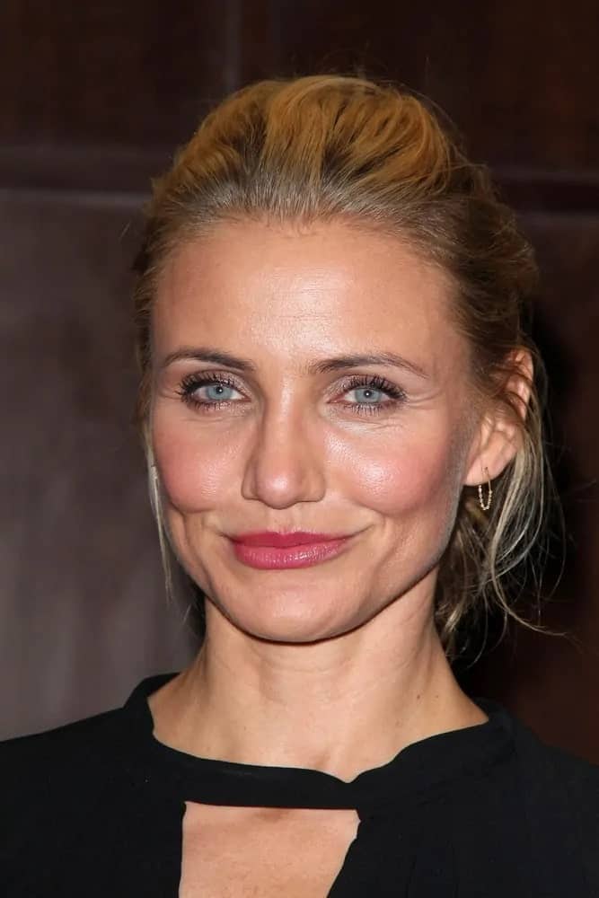 The American actress, Cameron Diaz, pulled back her ombre locks into high ponytail, leaving a few tendrils out over her ears at the Cameron Diaz Signs "The Body Book" on January 16, 2014.